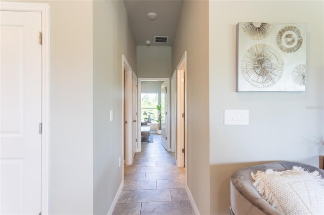 hallway with light tile patterned floors