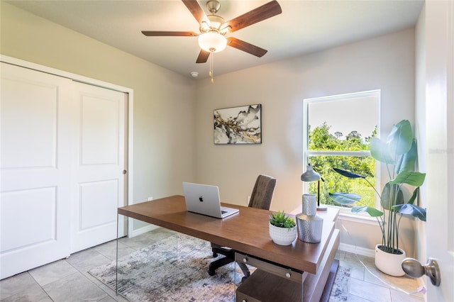 home office with ceiling fan and light tile patterned flooring