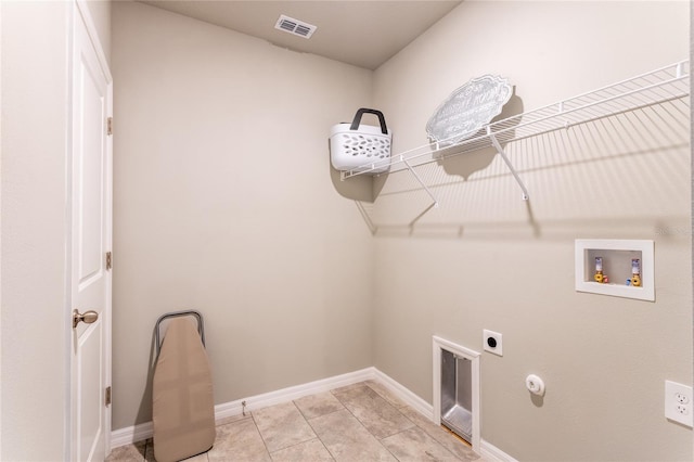 laundry area with light tile patterned floors, hookup for a gas dryer, hookup for a washing machine, and electric dryer hookup