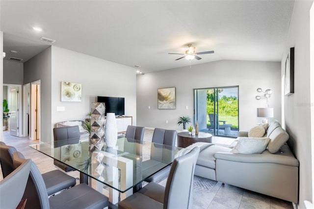 dining area featuring ceiling fan and lofted ceiling