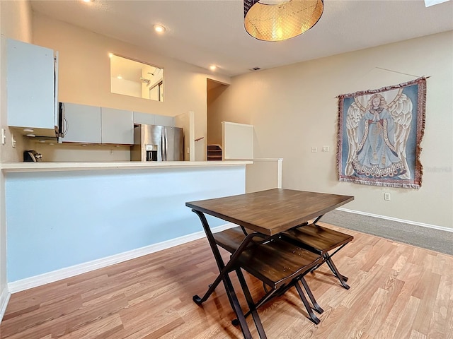 6262 93rd Ter N Unit 3904, Pinellas Park, FL 33782 - dining room featuring light wood-style flooring, stairs, and recessed lighting