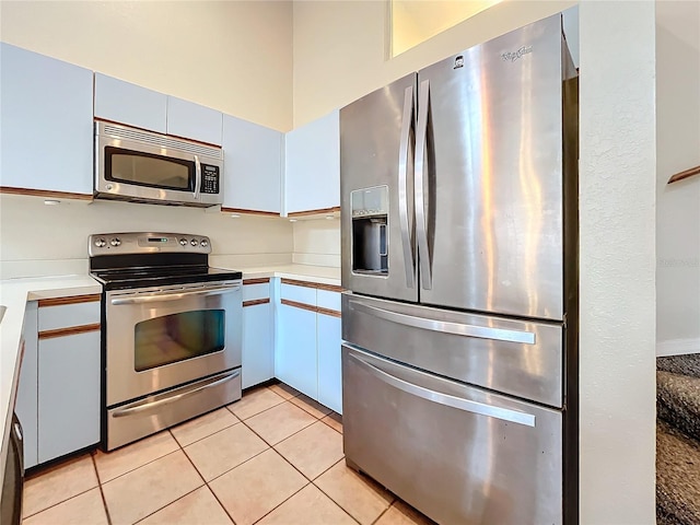6262 93rd Ter N Unit 3904, Pinellas Park, FL 33782 - kitchen featuring stainless steel appliances, light countertops, and light tile patterned floors