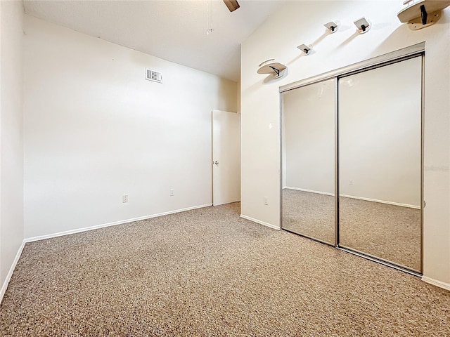 6262 93rd Ter N Unit 3904, Pinellas Park, FL 33782 - unfurnished bedroom with a closet, ceiling fan, and carpet