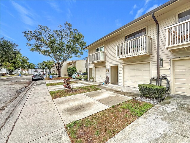 6262 93rd Ter N Unit 3904, Pinellas Park, FL 33782 - view of property with a garage and driveway
