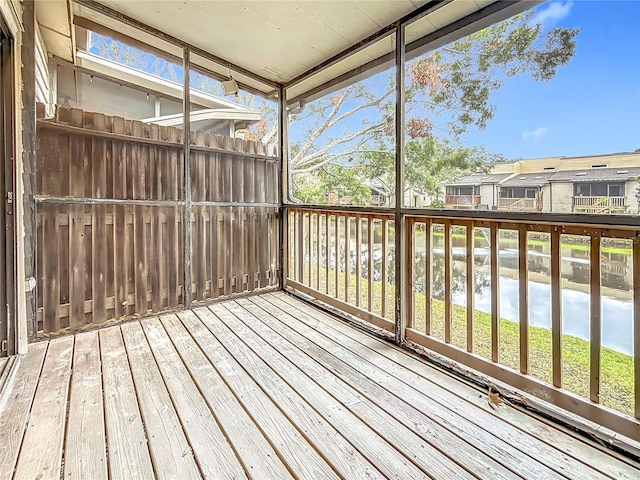 unfurnished sunroom with a residential view