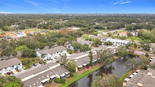 aerial view of residential area featuring a large body of water