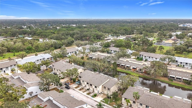 aerial view of residential area with a large body of water