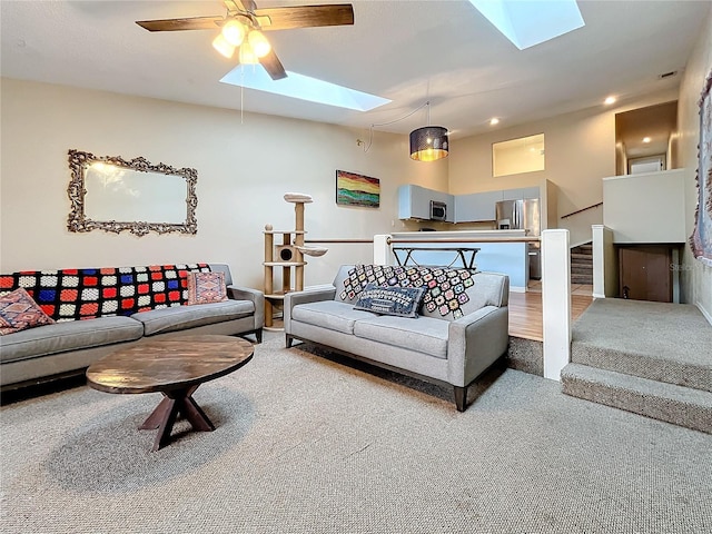 6262 93rd Ter N Unit 3904, Pinellas Park, FL 33782 - carpeted living area with a skylight, stairs, and ceiling fan