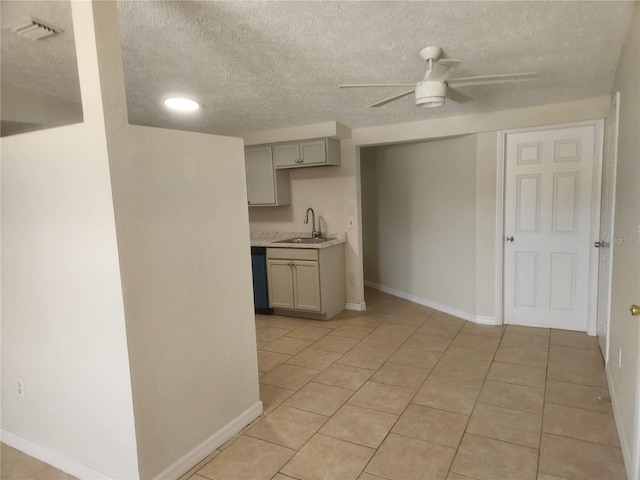 11608 Zimmerman Rd, Port Richey, FL 34668 - kitchen featuring gray cabinetry, a ceiling fan, light countertops, a sink, and a textured ceiling