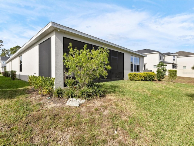 view of property exterior featuring a yard