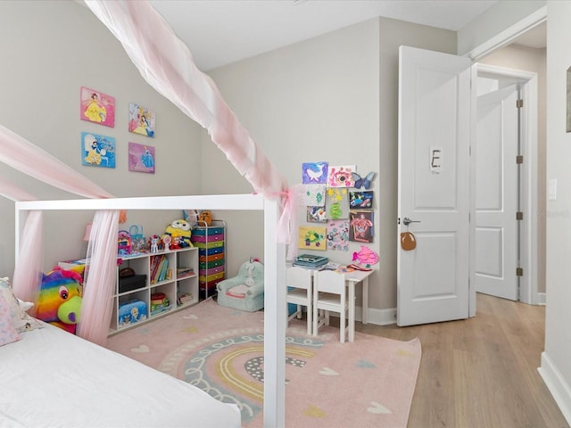 bedroom with light hardwood / wood-style flooring