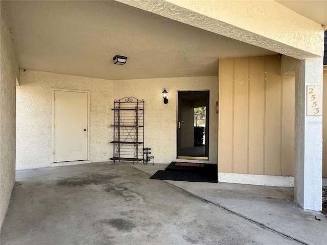 property entrance with a patio