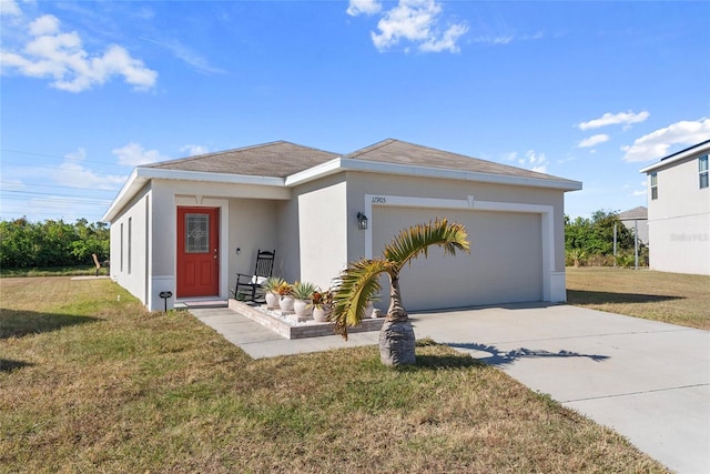 view of front facade featuring a garage and a front lawn