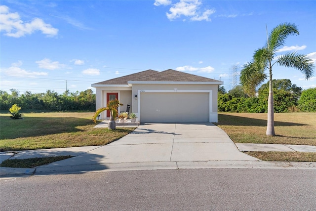 view of front of home featuring a front lawn and a garage