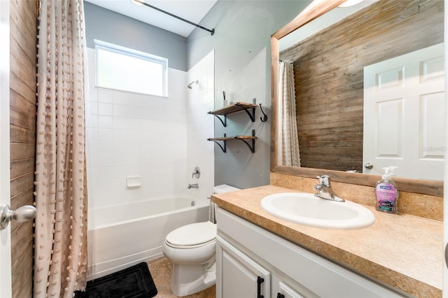 full bathroom featuring vanity, wood walls, tile patterned floors, toilet, and shower / bath combo with shower curtain