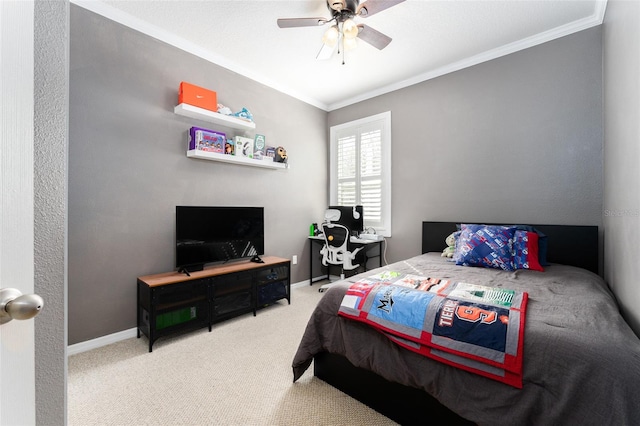 bedroom with carpet, ceiling fan, and crown molding