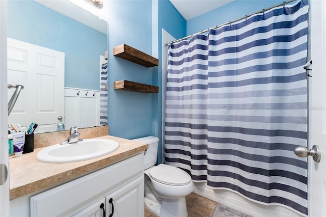 full bathroom with tile patterned floors, shower / bath combination with curtain, toilet, and vanity