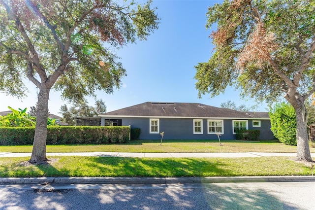 view of side of property with a yard