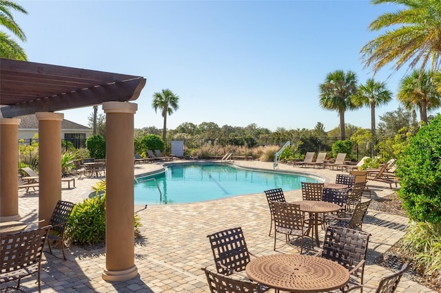 view of pool featuring a pergola and a patio