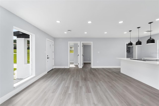 unfurnished living room with hardwood / wood-style floors