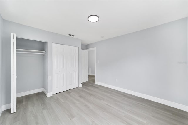 unfurnished bedroom with light hardwood / wood-style floors