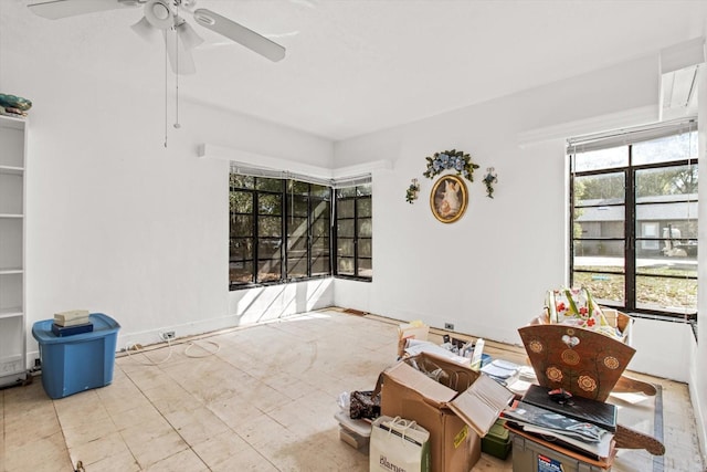 interior space featuring ceiling fan