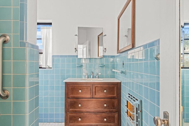 bathroom featuring walk in shower, radiator, vanity, heating unit, and tile walls