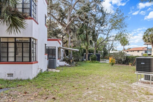 30 Kings Bay Dr, Crystal River, FL 34429 - view of grassy yard with central air condition unit