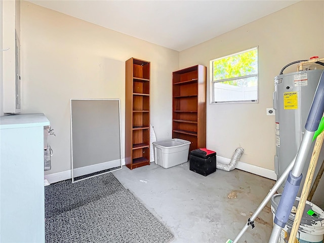 516 64th St S, Saint Petersburg, FL 33707 - misc room featuring unfinished concrete flooring and baseboards