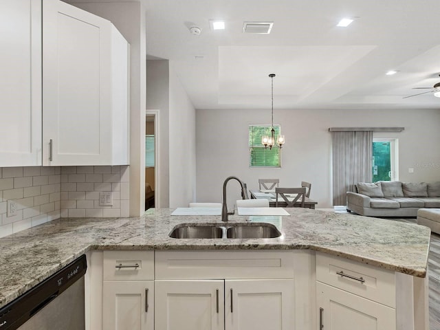 kitchen featuring dishwasher, decorative backsplash, white cabinets, and sink