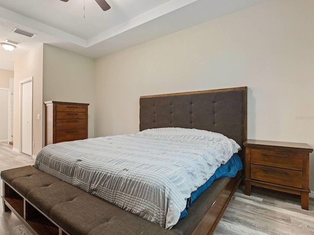 bedroom featuring light hardwood / wood-style floors and ceiling fan