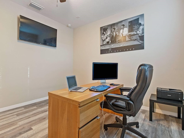 office space featuring hardwood / wood-style floors and ceiling fan