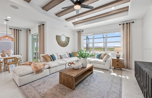 tiled living room with ceiling fan and beam ceiling