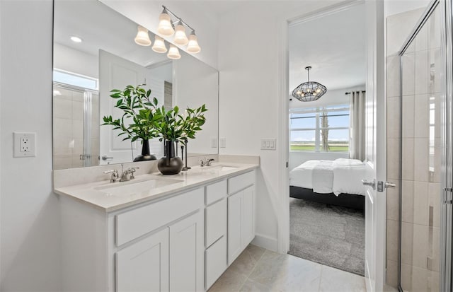 bathroom with plenty of natural light, an enclosed shower, vanity, and an inviting chandelier