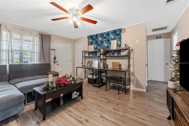 living room with hardwood / wood-style flooring and ceiling fan