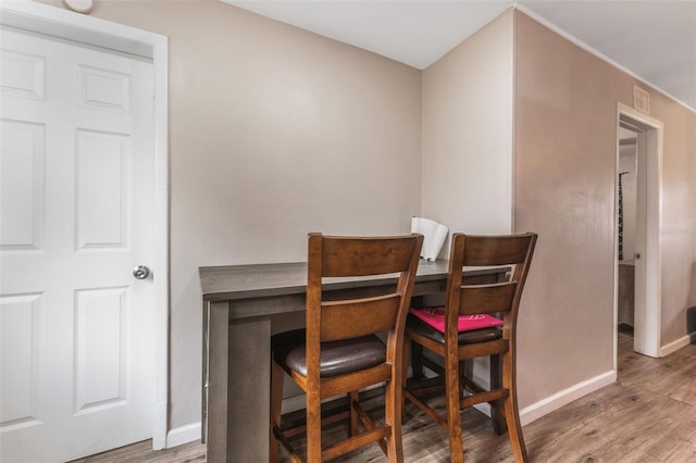 dining space featuring hardwood / wood-style flooring