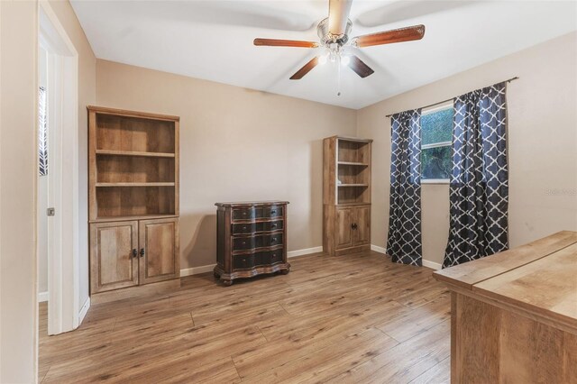 interior space featuring light wood-type flooring and ceiling fan