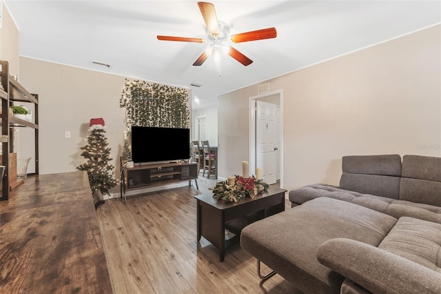 living room with hardwood / wood-style flooring and ceiling fan