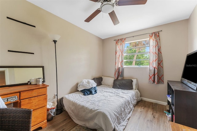 bedroom featuring light wood-type flooring and ceiling fan