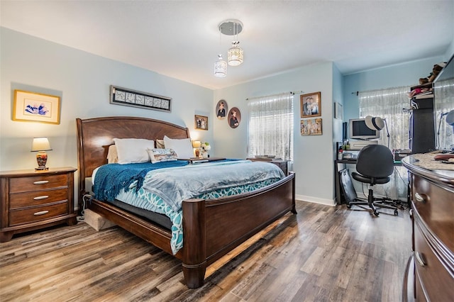 bedroom with hardwood / wood-style floors