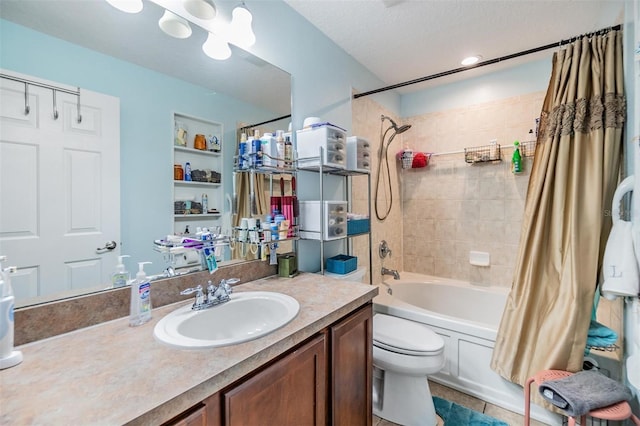 full bathroom featuring shower / tub combo with curtain, built in features, vanity, a textured ceiling, and toilet