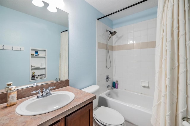 full bathroom with vanity, shower / bath combination with curtain, and toilet