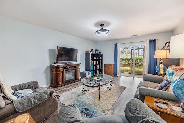 living room with light hardwood / wood-style floors