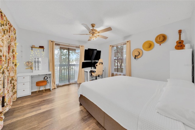 bedroom with ceiling fan, light wood-type flooring, and access to outside