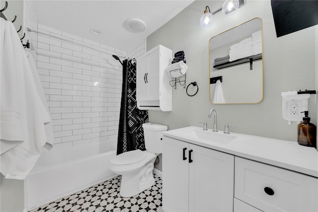 full bathroom with vanity, shower / bath combination with curtain, and toilet