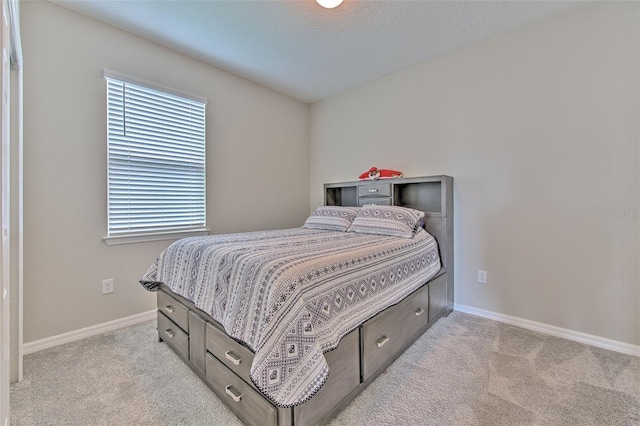 bedroom with light carpet