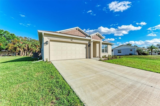 view of front of property featuring a front yard and a garage