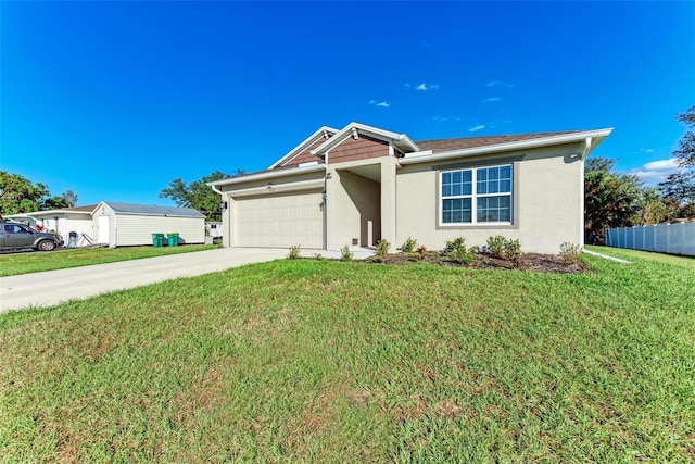 view of front of house featuring a front yard and a garage