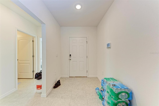 corridor with light tile patterned flooring