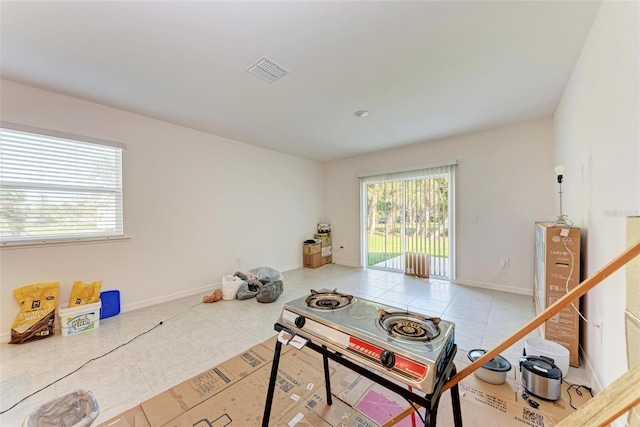 rec room with light tile patterned floors